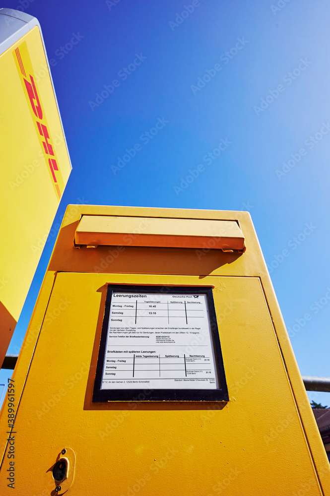 Berlin, Germany - September 17, 2020: Yellow mailbox from the German Post  under a blue sky. Stock Photo | Adobe Stock