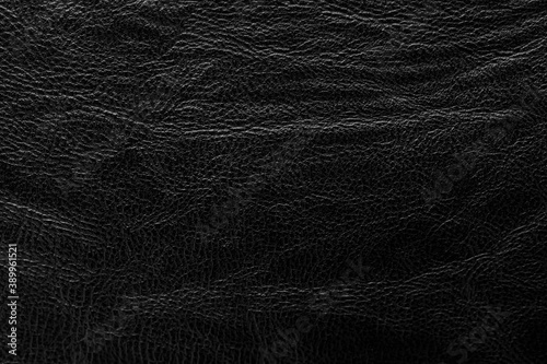 Black textured leather background. Abstract leather texture.