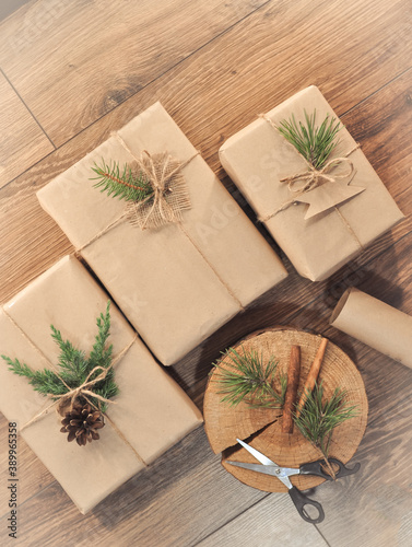 gifts in craft paper on wooden background photo