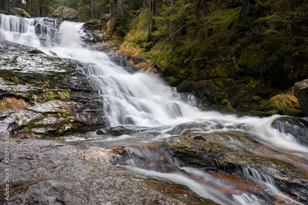 waterfall in the mountains, spectacular water flow, bohemian forest, germany