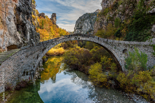 Kokori's old arch stone bridge (Noutsos) during fall season  situated on the river of Voidomatis in  Zagori, Epirus Greece.