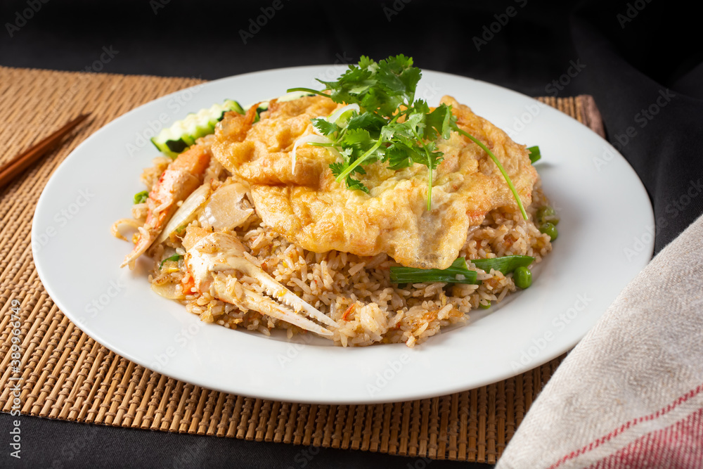 A view of a plate of crab fried rice.