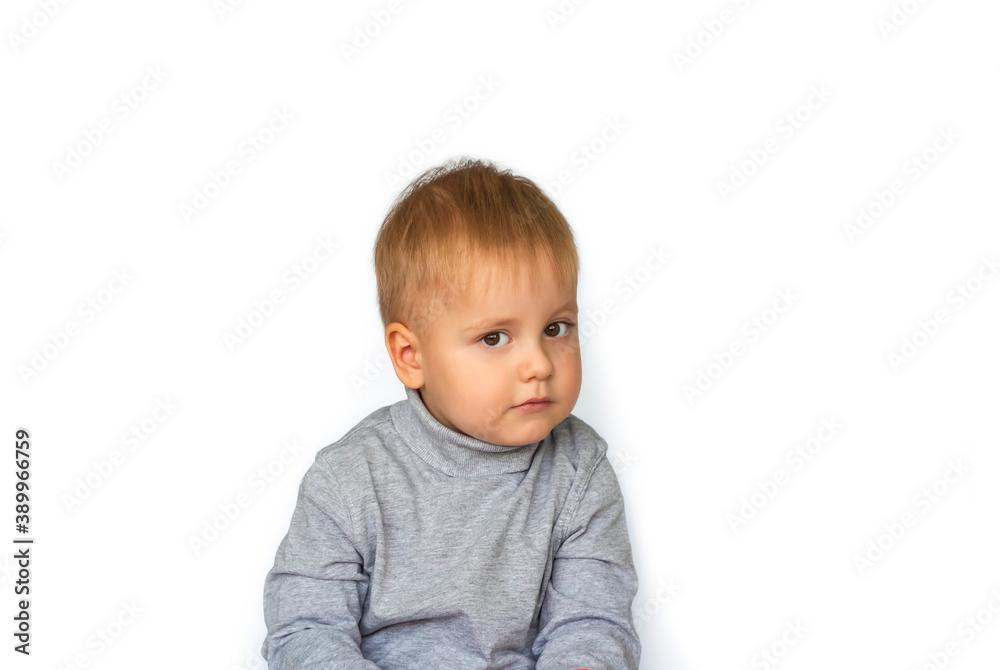 Portrait of a cute little boy. The child is isolated on a white background. Success, bright idea, creative ideas and innovative technological concepts.
