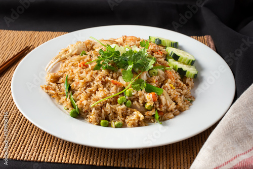 A view of a plate of crab fried rice.