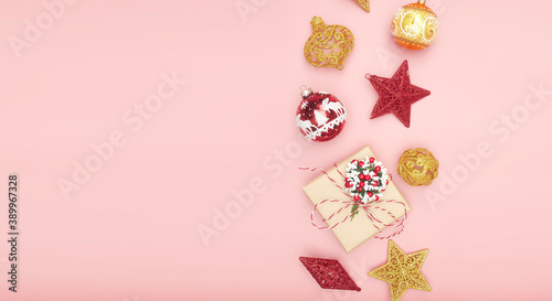Merry Christmas postcard banner, decorations on pink background, copy space