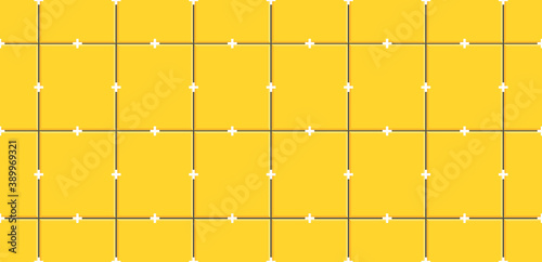 Yellow ceramic tiles with plastic crosses in joints on wall.Seamless pattern of ceramic tile