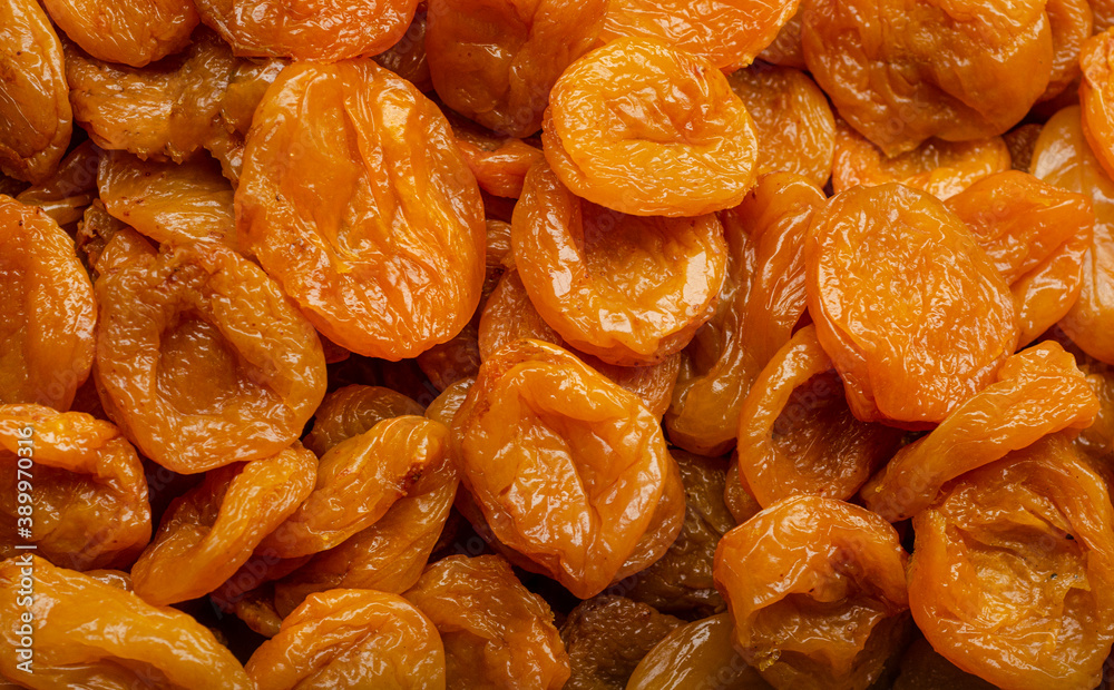 Lots of appetizing yellow dried apricots ready to eat