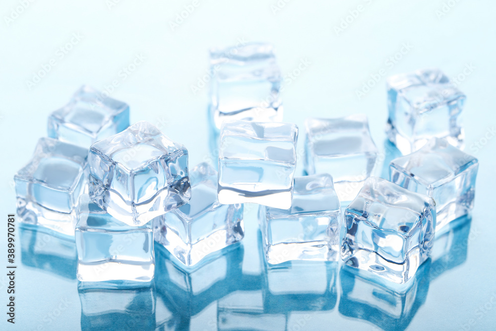 Obraz premium Ice cubes on blue background