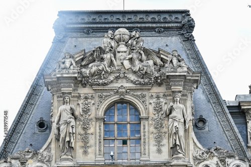 Fotografie, Obraz Sculptures on a wall of the Louvre museum Paris