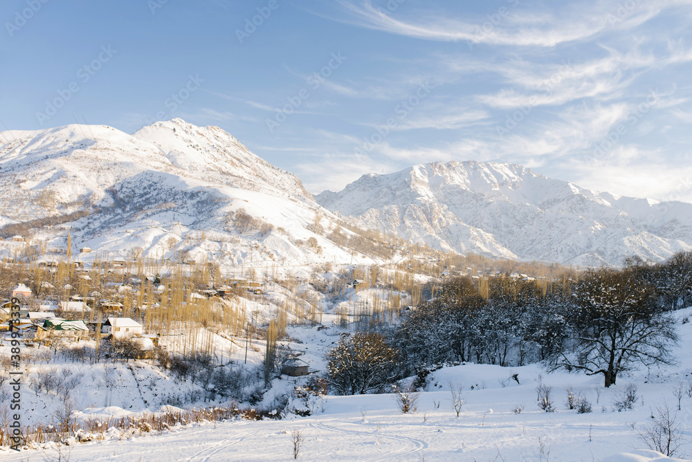 Winter beautiful mountain landscape of the Tianshan mountain system in Uzbekistan on a clear Sunny day. Chimgan Mountain
