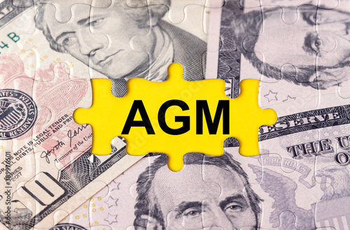 Puzzle with the image of dollars in the center of the inscription -AGM