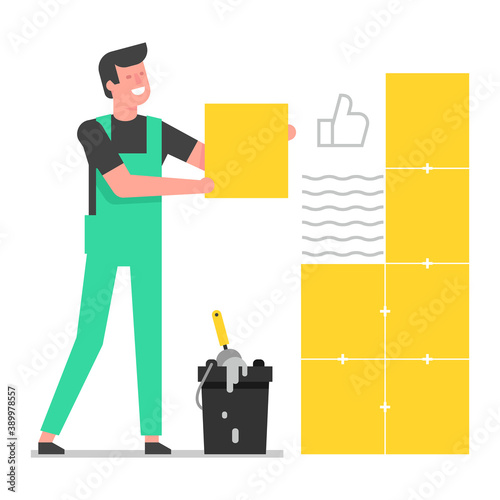 Tiler laying tiles. The tiler glue the ceramic tiles to the wall.  Laying tiles at home