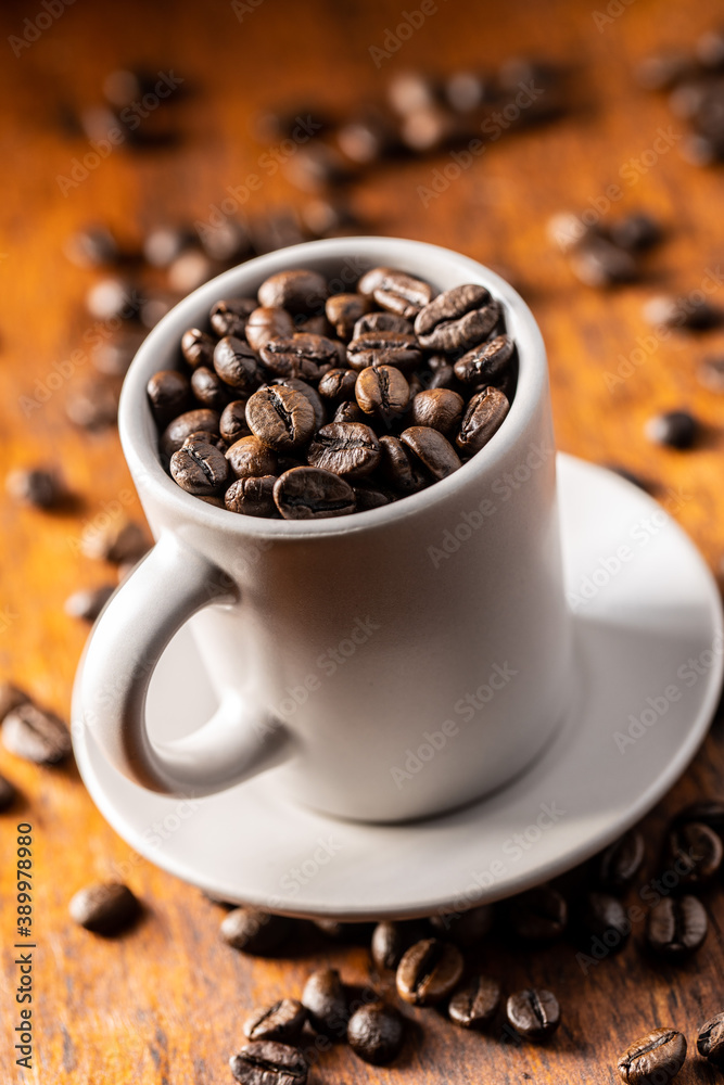 Fototapeta premium Roasted coffee beans in cup