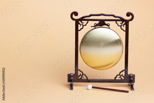 miniature wooden Gong with hammer. Isolated