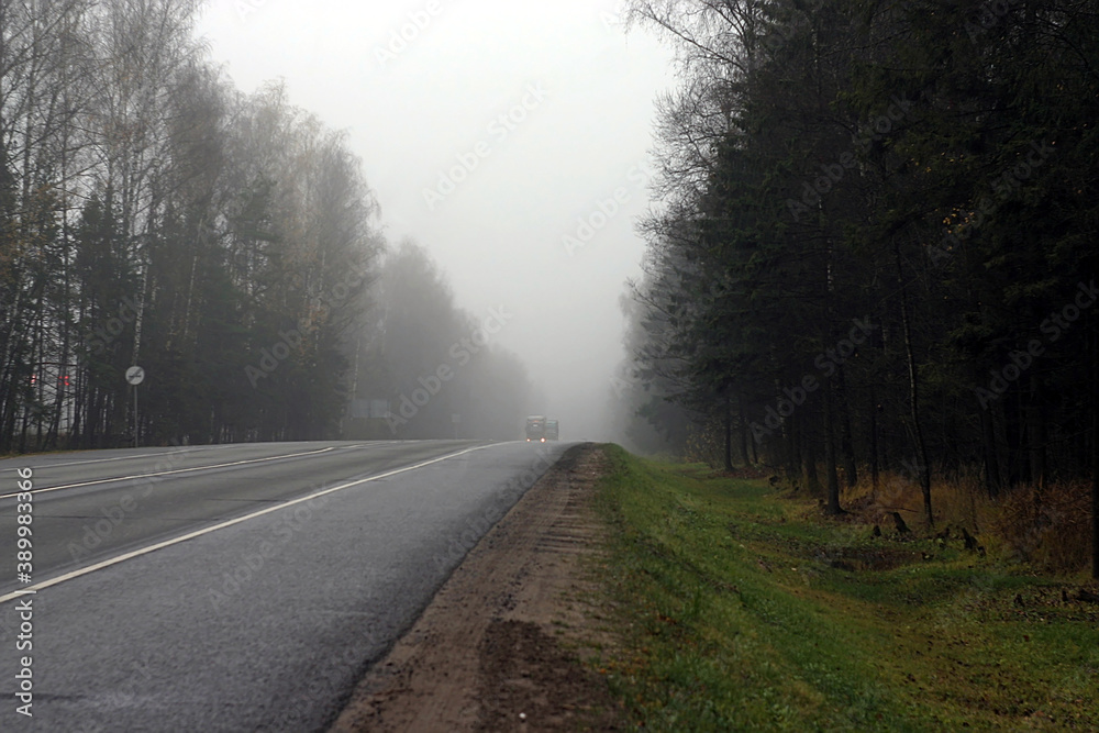 the road on a foggy autumn morning the road on a foggy autumn morning