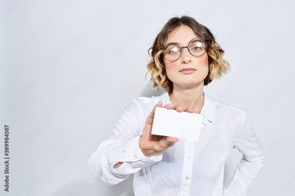 Business woman with credit card in hand light background mockup Business woman with credit card in hand light background mockup