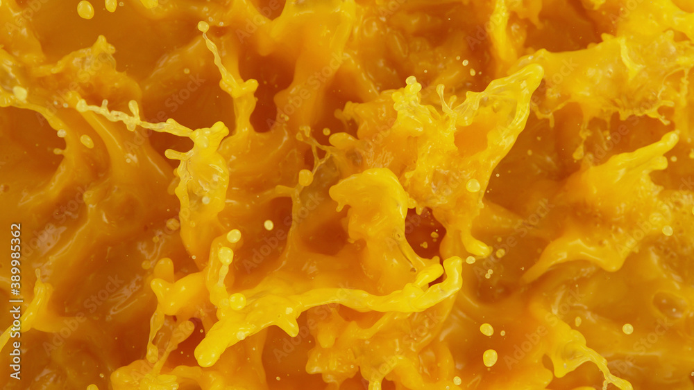 Closeup of splashing orange juice Closeup of splashing orange juice