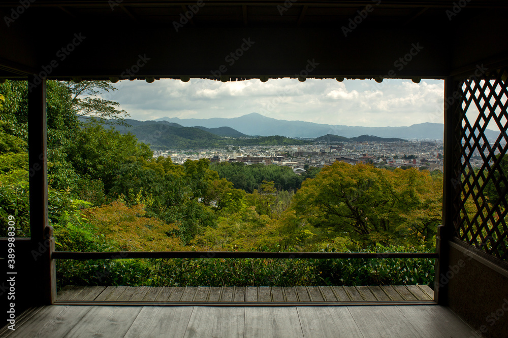 view of Kyoto and the mountains from the window of a traditional house. view of Kyoto and the mountains from the window of a traditional house.