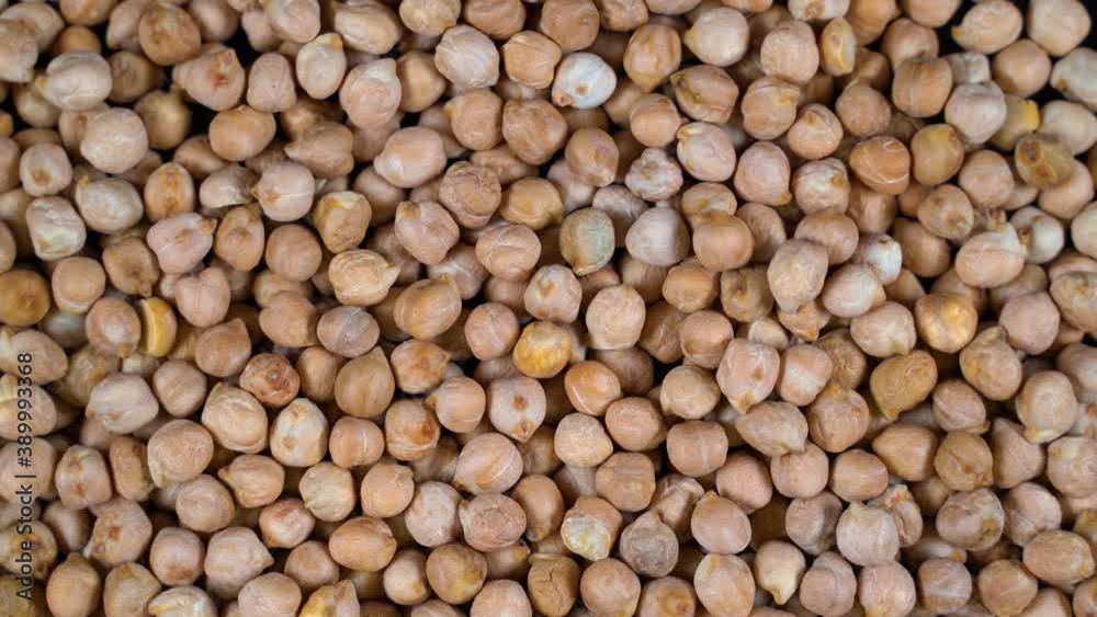 Scattered Turkish chickpeas are rotated on the table. High protein legumes,beans and lentils for healthy food. Scattered Turkish chickpeas are rotated on the table. High protein legumes,beans and lentils for healthy food.