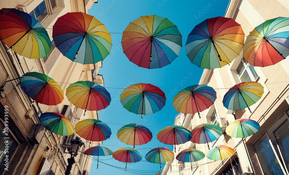 Obraz premium Colorful decorative umbrellas hanging over in the city