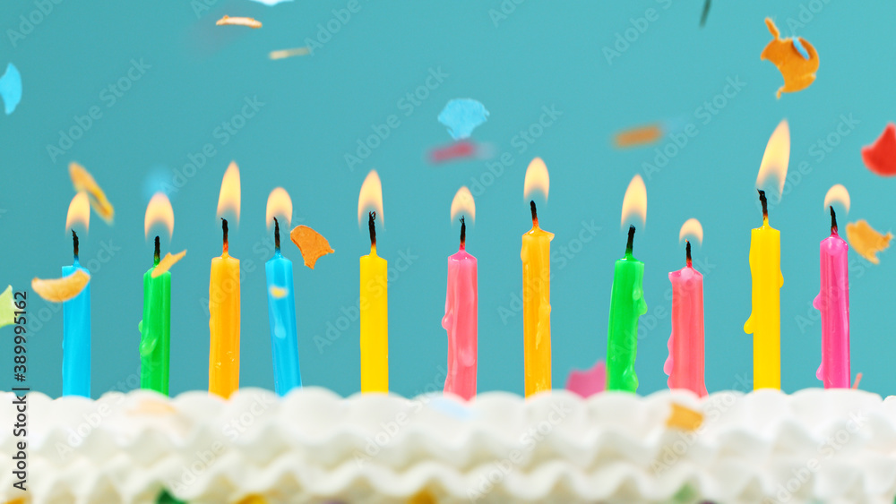 Birthday cake with candles on pastel blue background
