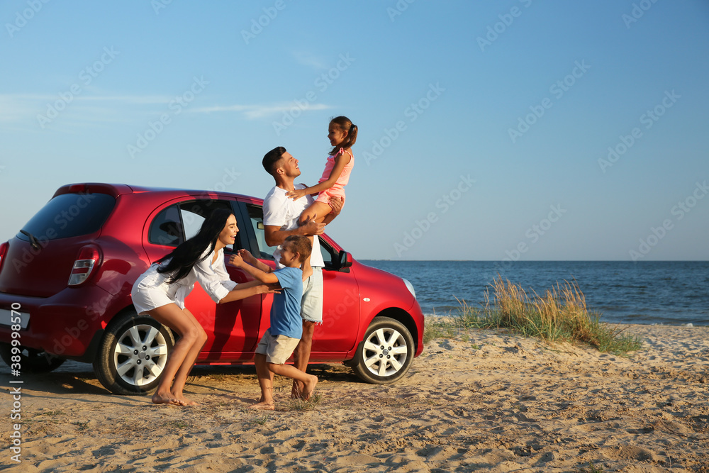 © New Africa - Happy family having fun near car on sandy beach. Summer trip © New Africa - Happy family having fun near car on sandy beach. Summer trip