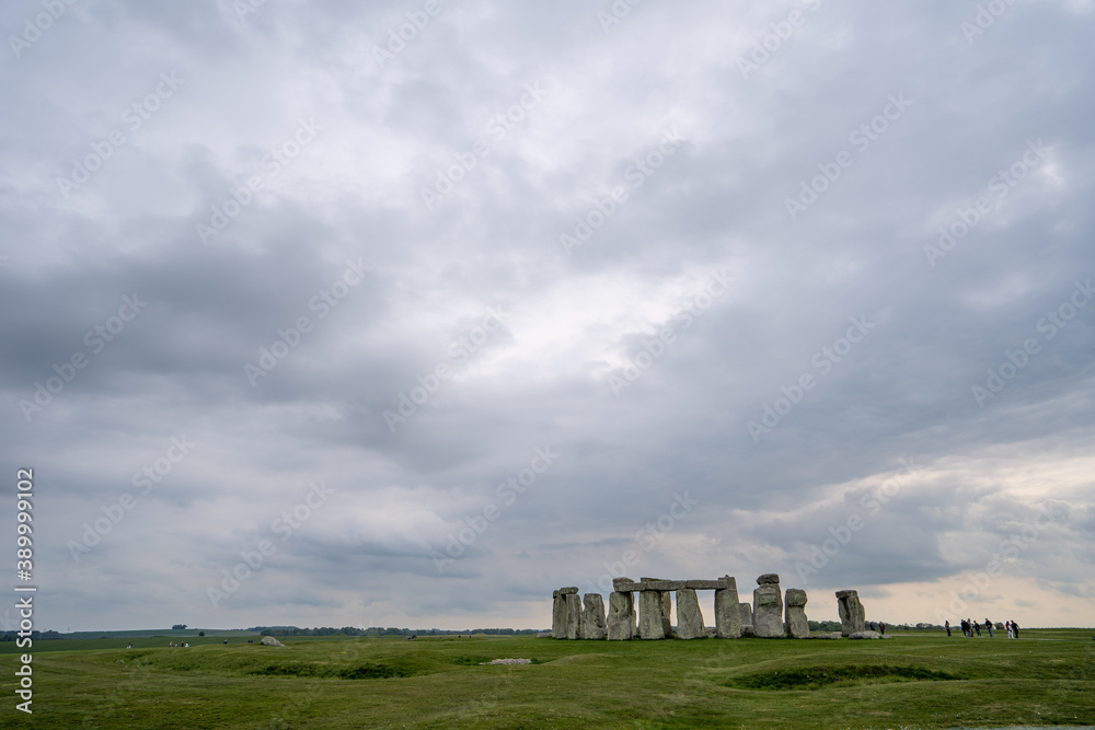 Wide shot of Stonehenge on a cloudy day in Wiltshire, England.