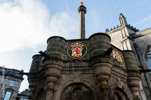 Low angle shot of the Mercat Cross in Edinburgh Parliament Square, Scotland, United Kingdom photo