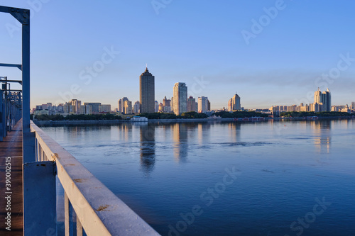 A view of skyscrapers on the banks of the Songhua River in Harbin, China © 客半山居
