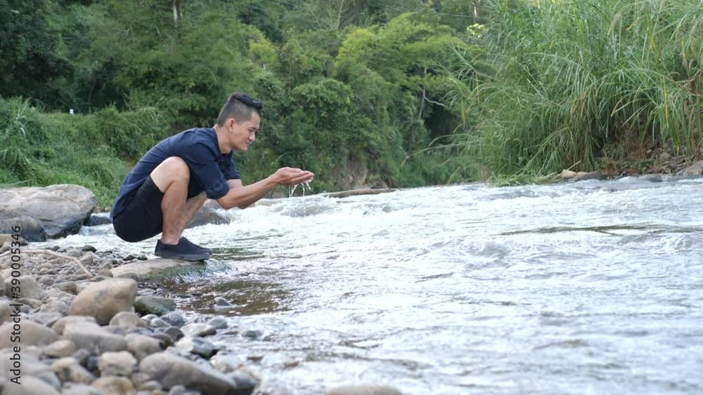 Close-up hands business man touching water in nature and life concept Close-up hands business man touching water in nature and life concept