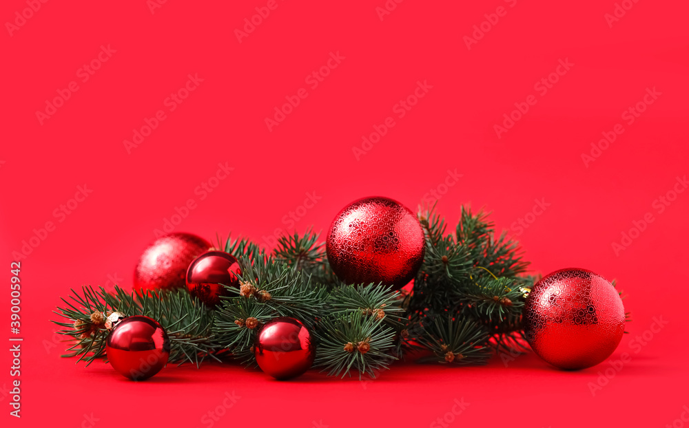 Beautiful Christmas balls and fir branches on red background. Space for text Beautiful Christmas balls and fir branches on red background. Space for text