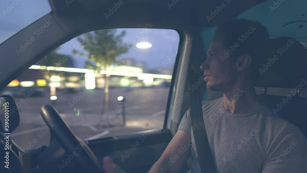 Man drive car at night. View through windshield Man drive car at night. View through windshield