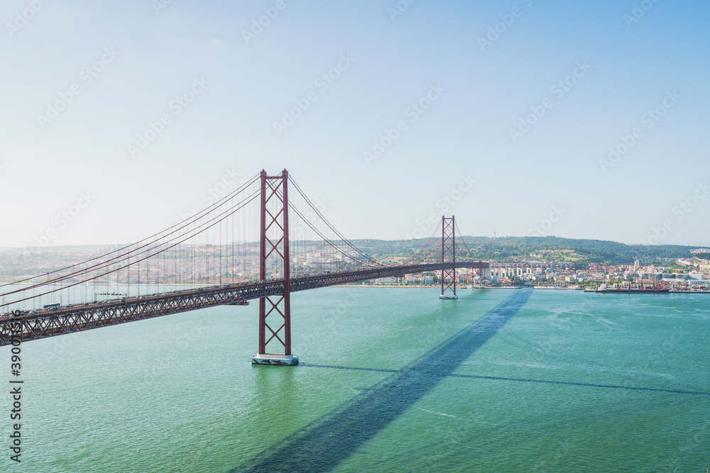 Fototapeta premium The April 25th bridge (Ponte 25 de Abril) and Lisbon city landscapes