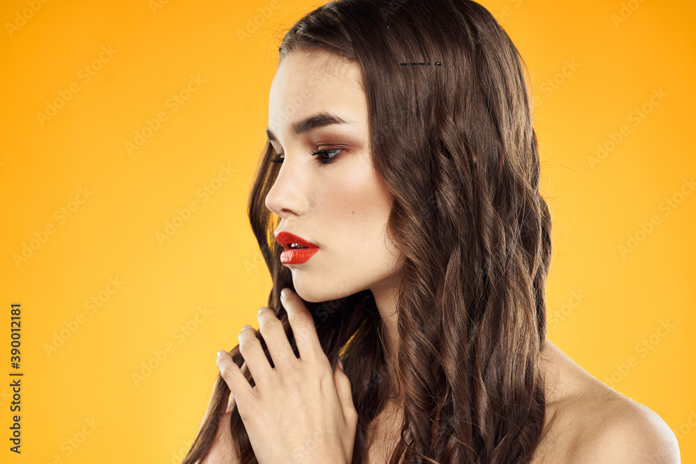 Woman with bare shoulders red cropped lips charm yellow background Woman with bare shoulders red cropped lips charm yellow background
