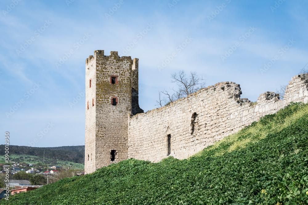 Medieval wall and tower of Genoese fortress in the city of Feodosia on the Crimean Peninsula, built by colonists from Genoa in the 14th century