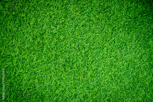 Green artificial grass texture for background photo