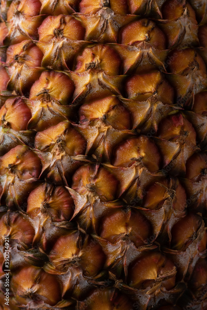Ripe and orange pineapple peel, background texture. Macro texture. Ripe and orange pineapple peel, background texture. Macro texture.