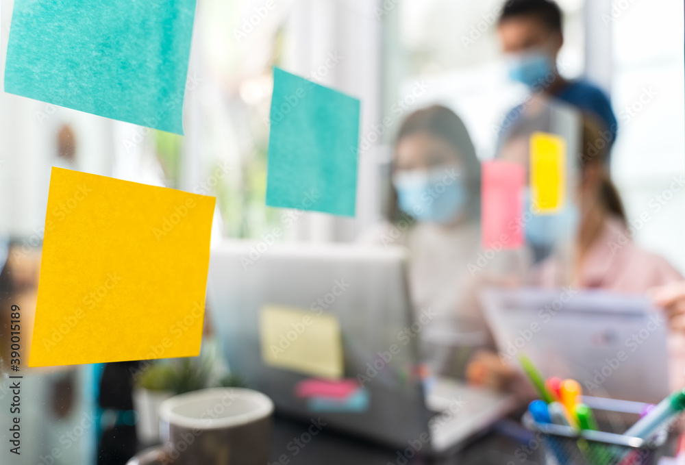 custom made wallpaper toronto digitalPost-it paper or remind paper for writing text on clear acrylic partitions In the Home Office with blur group of colleagues are consulting or brainstrom, Soft focus and focus at foreground.