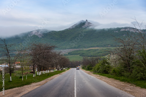 Road towards the mountains covered with clouds on the Crimean Peninsula
