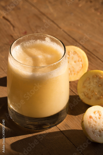 glass of cured guava pulque photo