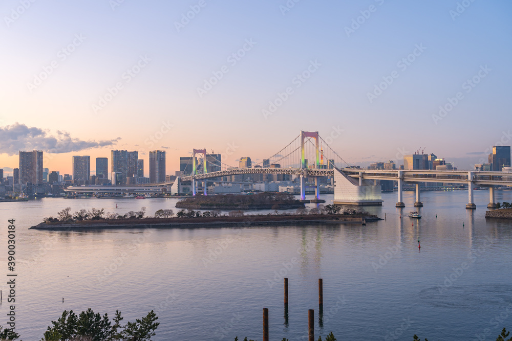 Tokyo bay at twilight with view of Rainbow Bridge in Tokyo city, Japan