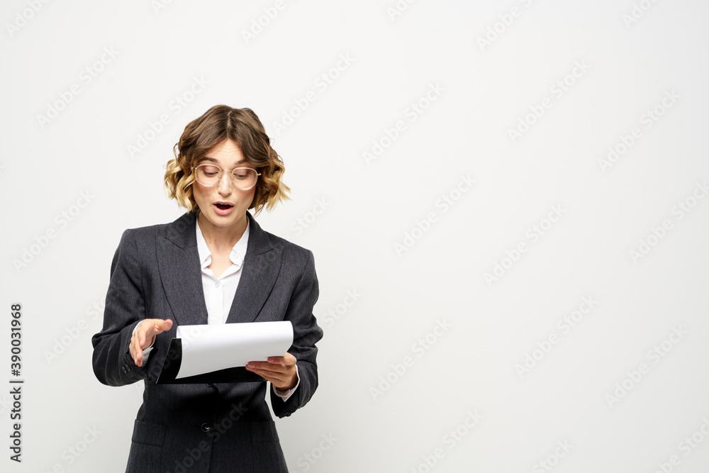 Woman in business suit finances work documents glasses hairstyle Woman in business suit finances work documents glasses hairstyle
