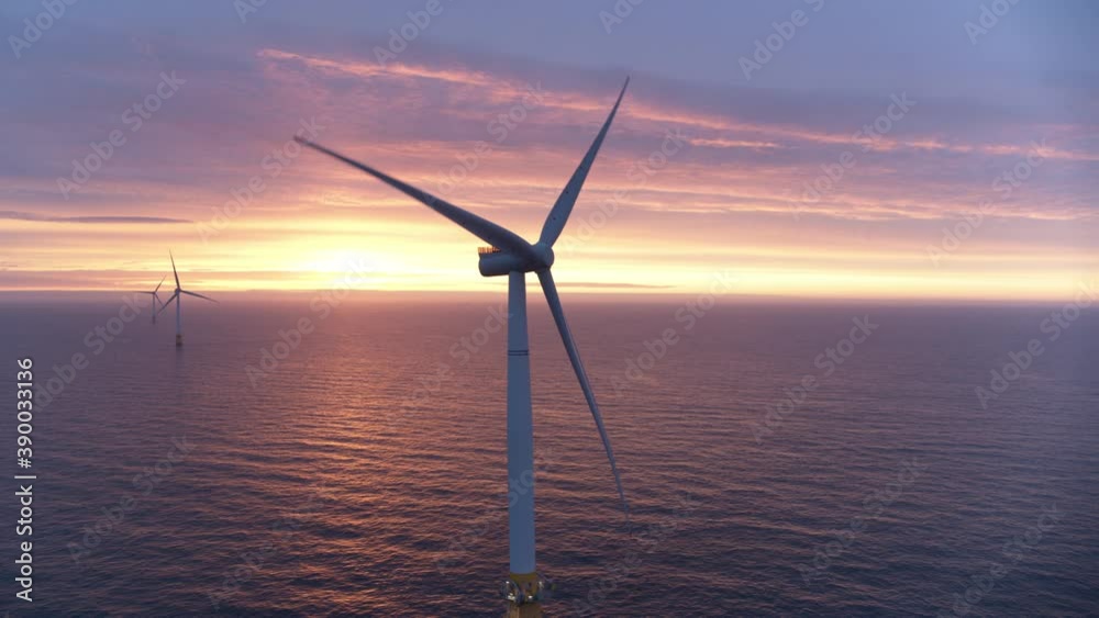 Sunset aerial shot of working windmill turbine blades, alternative eco-friendly energy sources industry 01 Sunset aerial shot of working windmill turbine blades, alternative eco-friendly energy sources industry 01