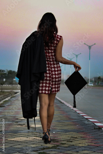 Girl graduation moments from the back in evening