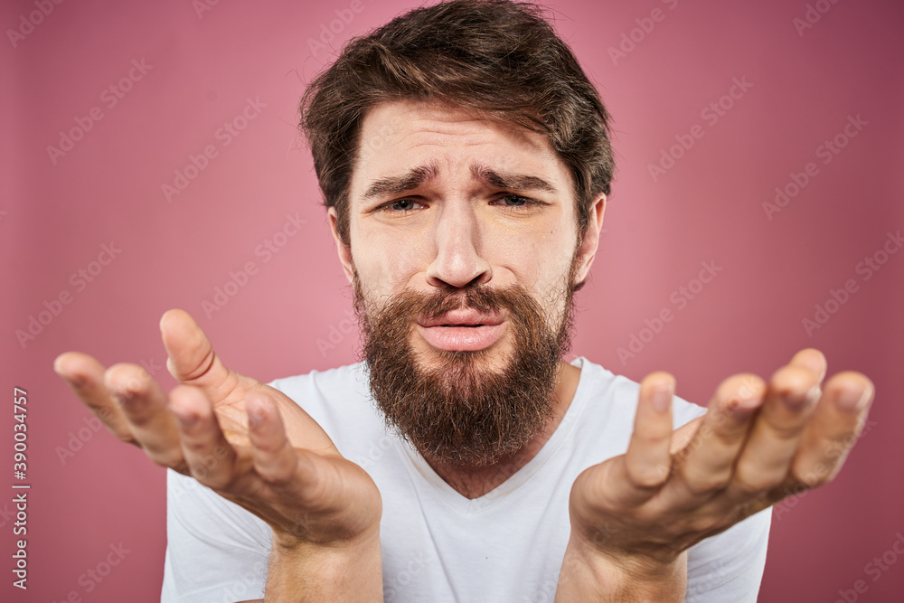 bearded man in white t-shirt emotions displeased facial expression studio pink background bearded man in white t-shirt emotions displeased facial expression studio pink background