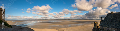 Panoramic view of quicksand on the coast from Abbey Mont Saint Michel stone wall. Normandy, France