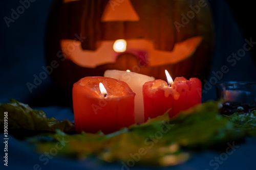 Pumpkin head with candles in the twilight. Horizontal layout.