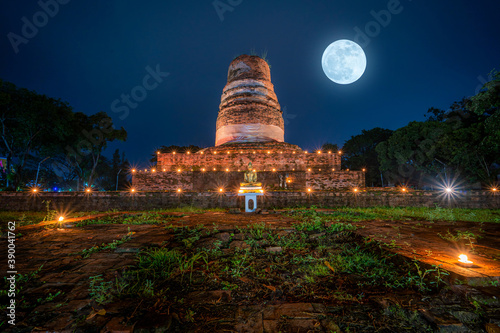 Beautiful scene light color The Loy Krathong festival 2020 at Pagoda in the Wat Aranyik is a historic temple  at night is a tourist Phitsanulok  Thailand.With full moon