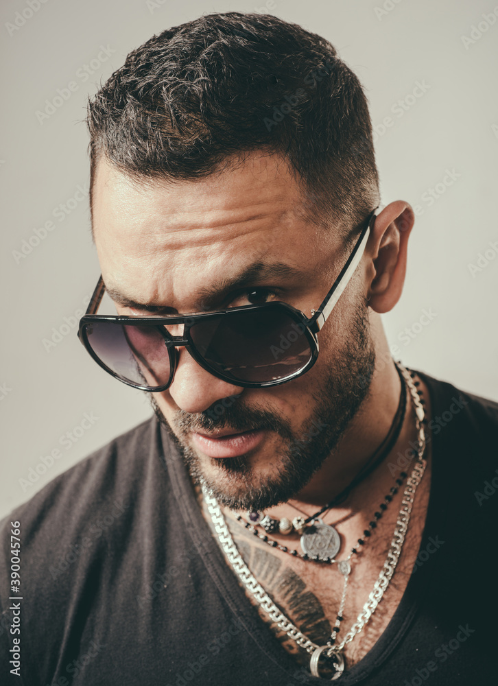 Obraz premium Close up portrait of Handsome young man with sunglasses.