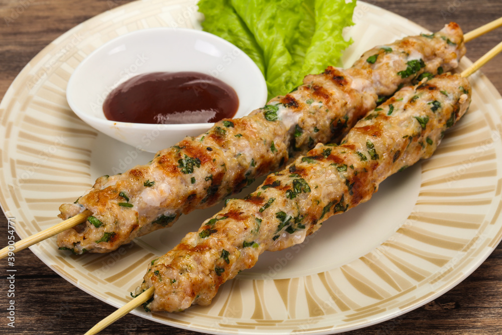 Minced pork skewer kebab with sauce